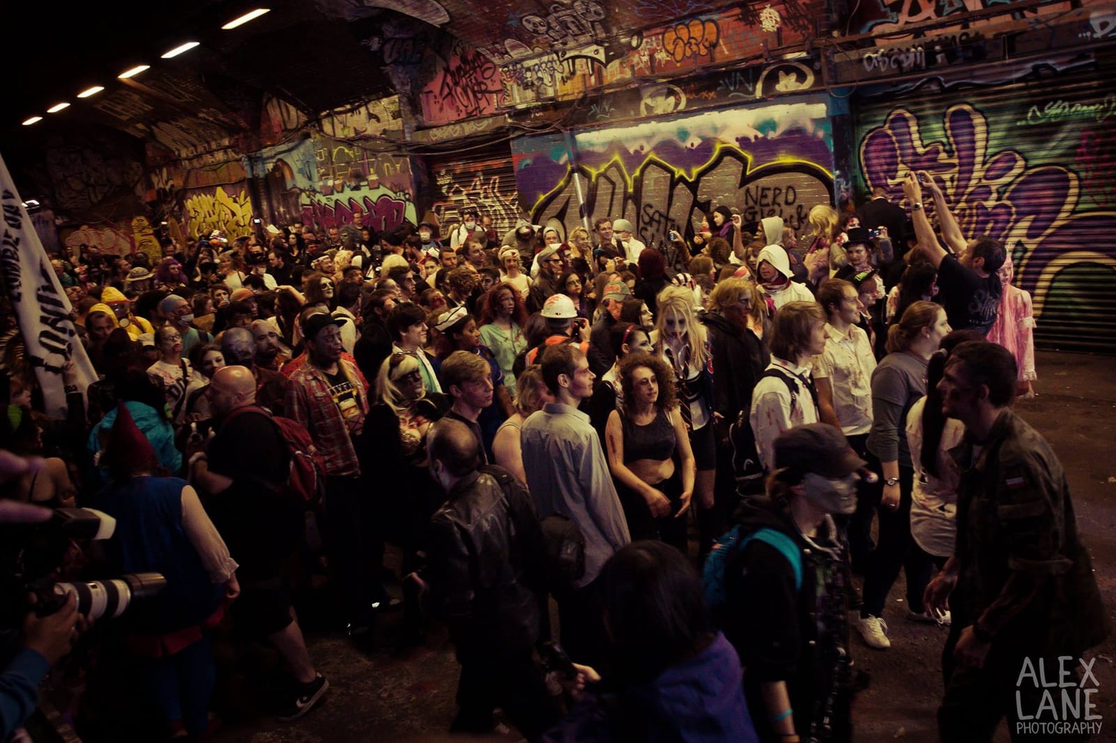 Several hundred zombies fill the graffiti-covered Leake Street tunnel, waiting for the walk to move off.